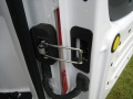 2010 Ford Transit Connect. The hinges automatically fall back into place when claosing the door.