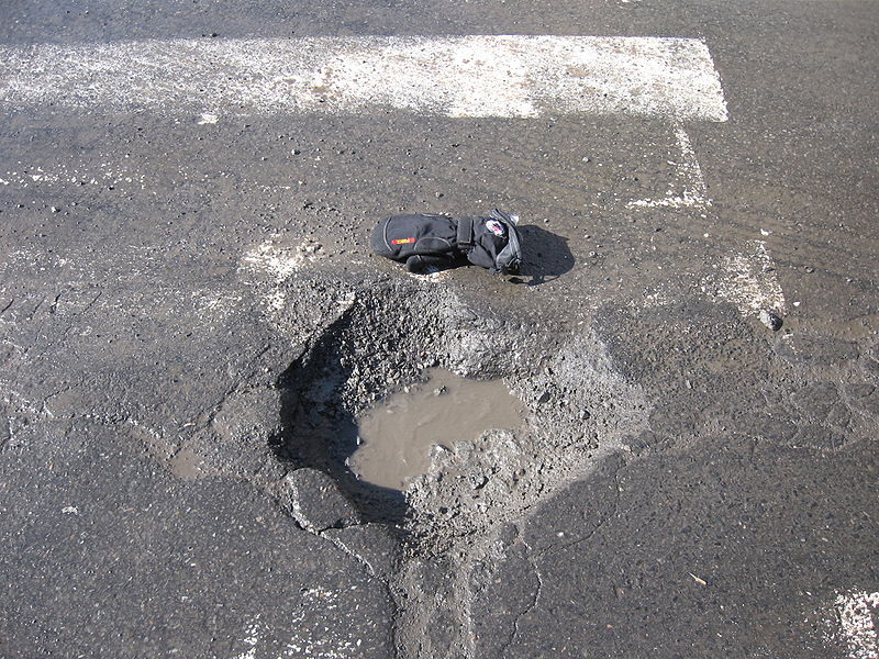 Car Killing Pothole