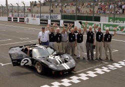 LE MANS CLASSIC 2006: Pictured with the winning 1966 Le Mans 24-hour Ford GT40 are (Left to Right):   ?- Lee Holman, who heads the American motorsport specialists Holman Moody. The team was another 1966 Ford entrant, and a young Lee Holman was on hand at Le Mans when a team entry finished third.- Jean Luc Gerard, Chairman and Managing Director for Ford France?- John Fleming, President and CEO for Ford of Europe?- Jim Wallace, tyre specialist for the winning Shelby American team and now representing Carroll Shelby Enterprises.?- Phil Henny, crew chief of the 1966 Filipinetti GT40, which ran as high as fifth before being sidelined by a crash?- Harry Calton, Ford of Britain's Chief Press Officer at the 1966 Le Mans 24h race?- Ian Slater, Vice President of Communications And Public Affairs for Ford of Europe?- Sir John Whitmore, who qualified third in the 1966 race but failed to finish due to mechanical woes. Whitmore brought home the historical connection with 1966 by reprising his role from four decades earlier, piloting a 1964 GT40 with Britain?s Shawn Lynn at the Le Mans Classic.?- Alan Mann, team owner of the infamous Alan Mann Racing company, one of Ford?s three multi-car entrants for the 1966 race?- Brian Lewis, mechanic for Alan Mann Racing, whose car was first off the line that fateful Saturday in 1966.?- Just visible in the driving seat is the current American collector who owns the car, Mr George Stauffer